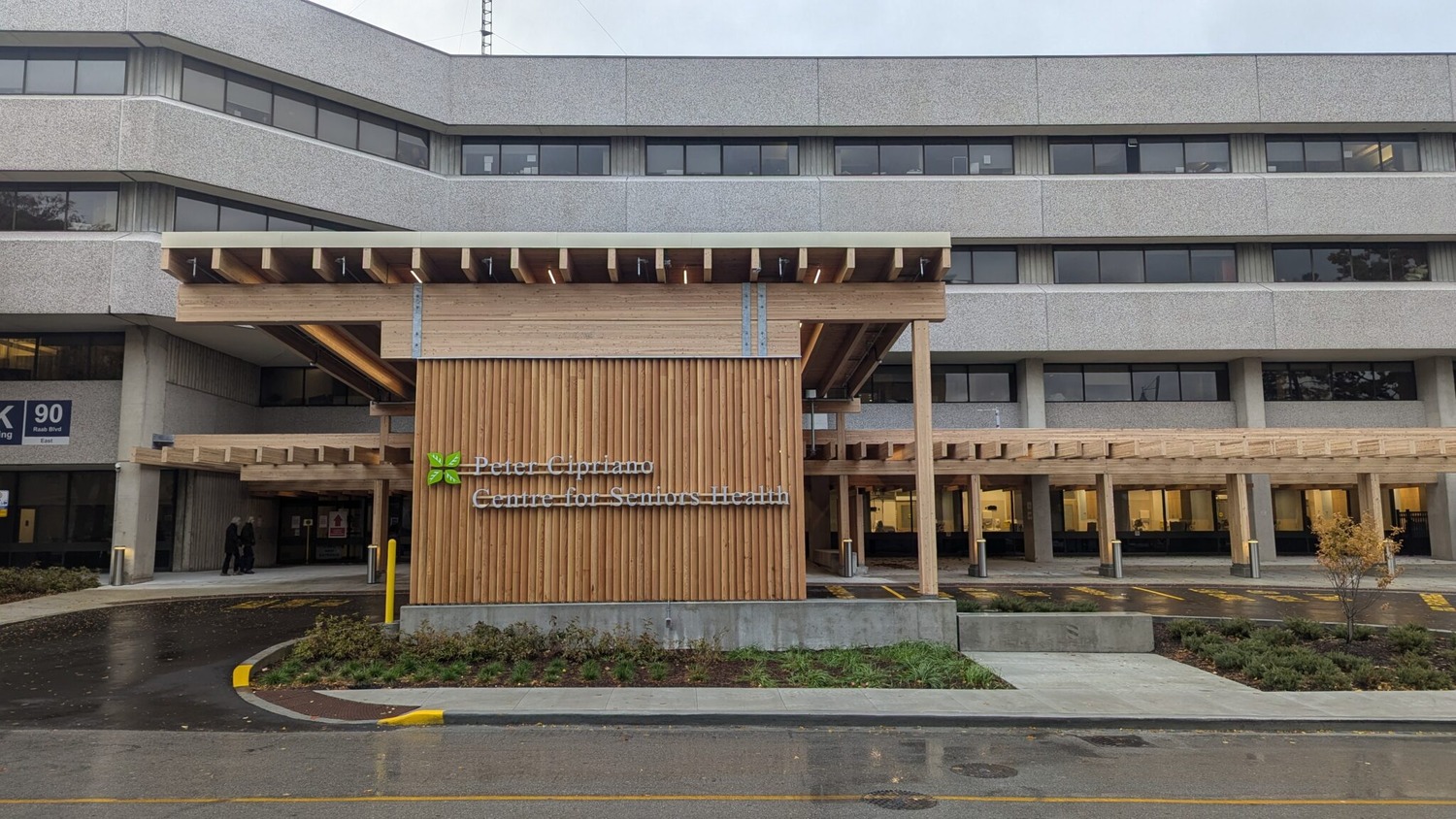 The exterior of a multi-story building with the sign 